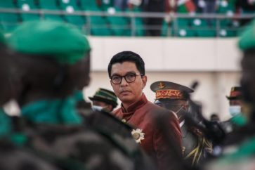 (FILES) In this file photograph taken on June 26, 2021, Madagascar's President Andry Rajoelina inspects troops during Independence Day celebrations at The Barea Stadium in Antananarivo. The prosecutor general's office in Madagascar has said July 22, 2021, that it has foiled an assassination attempt on President Andry Rajoelina, and arrested several "foreign and Malagasy" suspects. Two French people are among several arrested in the Indian Ocean island nation on July 20, "as part of an investigation for undermining state security", diplomatic sources said.
(Photo by RIJASOLO / AFP)